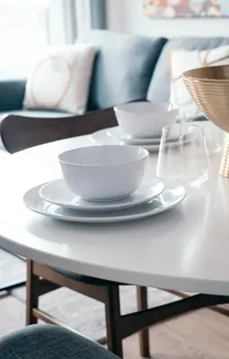 a white coffee table with two bowls on it at Griffintown Hôtel in Montréal