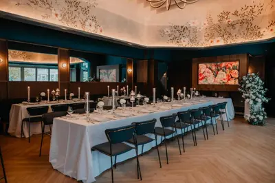 a long table with white tables and chairs in a room at Hilton Garden Inn Montreal Midtown, Quebec, Canada in Montréal
