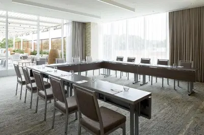 a conference room with a long table and chairs at Homewood Suites By Hilton Montreal Midtown in Montréal