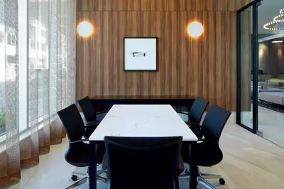 a conference room with a white table and chairs at Homewood Suites By Hilton Montreal Midtown in Montréal