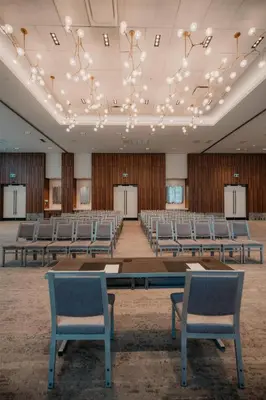 an empty conference room with chairs and tables and lights at Homewood Suites By Hilton Montreal Midtown in Montréal