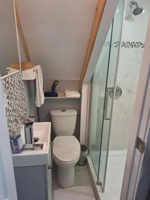 a small bathroom with a toilet and a shower at Well Equipped Studio FOR NON-SMOKING GUESTS ONLY CITQ ЗO9467 in Longueuil