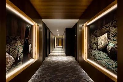 a hallway with a row of beds on the walls at Humaniti Hotel Montreal, Autograph Collection in Montréal