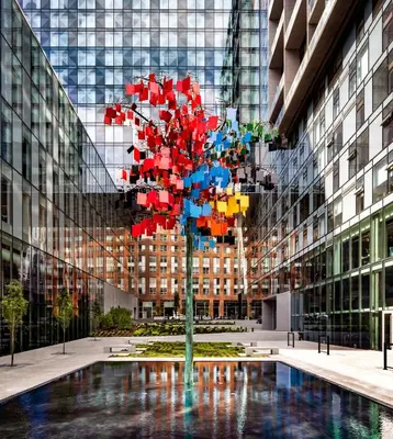 a tree in the middle of a building at Humaniti Hotel Montreal, Autograph Collection in Montréal