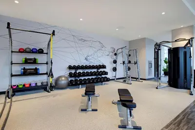 a room with a gym with weights and equipment at Hampton Inn Montreal Downtown, Qc in Montréal