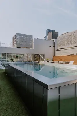a large swimming pool on the roof of a building at Hampton Inn Montreal Downtown, Qc in Montréal