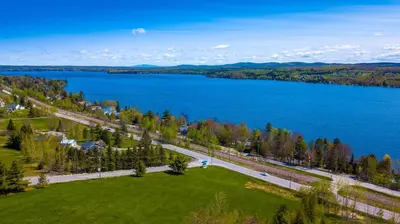 an aerial view of a lake and a road at Au Sommet du Lac Magog in Magog-Orford