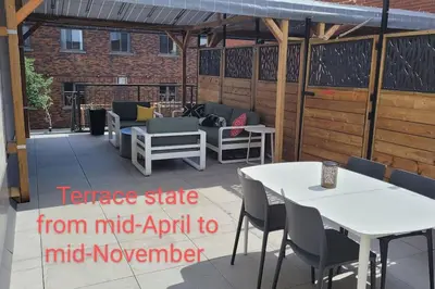 a patio with tables and chairs and a pavilion at Plaza10 - 20 restaurants at under a 10 minute walk in Montréal