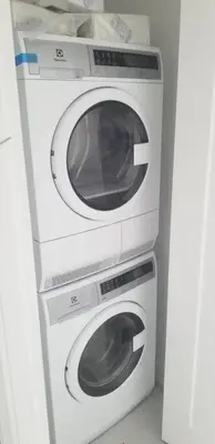 two washing machines stacked on top of each other at Plaza12 - StringLights, XL Terrace, restos & shops in Montréal