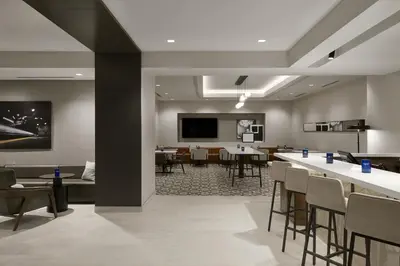 a conference room with tables and chairs and a tv at Hyatt Place Montreal - Downtown in Montréal