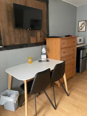 a white table and two chairs in a room at Motel Valois YL inc in Acton Vale