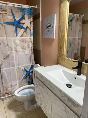 a bathroom with a sink and a toilet and a shower at Motel Valois YL inc in Acton Vale