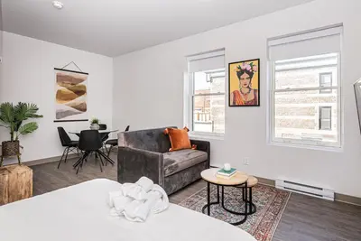 a living room with a couch and a table at Wonderful New Studio close to Mount Royal By Den Stays in Montréal