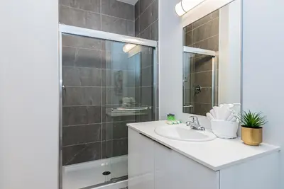 a bathroom with a sink and a shower at Wonderful New Studio close to Mount Royal By Den Stays in Montréal