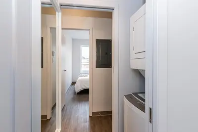 a hallway with a door leading to a bedroom at Stylish & Fun 1 Bedroom Apartment in Le Plateau by Den Stays in Montréal