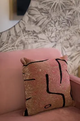 a pillow sitting on top of a couch at Perfect Business Trip Studio with Full Amenities by Den Stays in Montréal