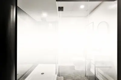 a room with a glass door and a bathroom at Hygie Boutique Hotel in Montréal