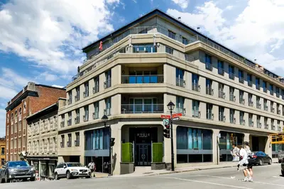 a large building on the corner of a street at Hygie Boutique Hotel in Montréal