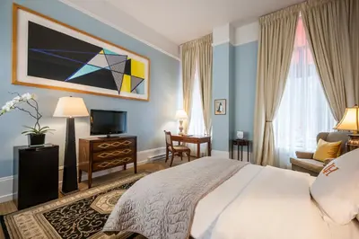 a hotel room with a bed and a tv at LHotel in Montréal