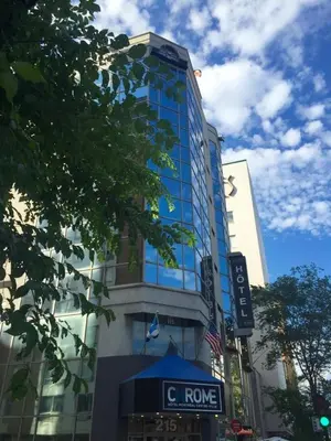a tall building with a c tower sign on it at Hotel Chrome Montreal Centre-Ville in Montréal