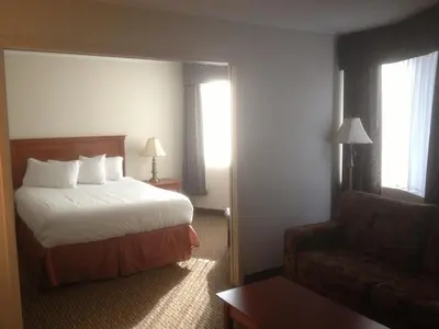 a hotel room with a bed and a couch at Hotel Chrome Montreal Centre-Ville in Montréal