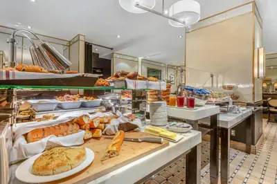 a buffet line with many different types of food at Omni Mont-Royal Hotel in Montréal
