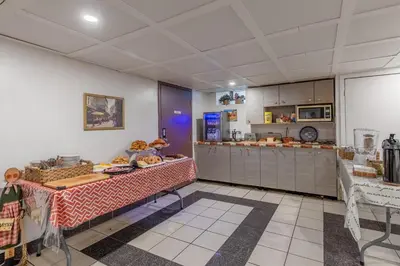 a kitchen with a table with food on it at Hotel Auberge Manoir Ville Marie in Montréal