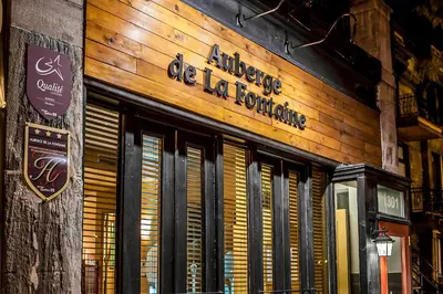 a store front of a restaurant with a sign on it at Auberge de La Fontaine in Montréal