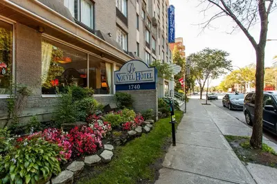 a sign for a water food store on a street at Le Nouvel Hotel in Montréal