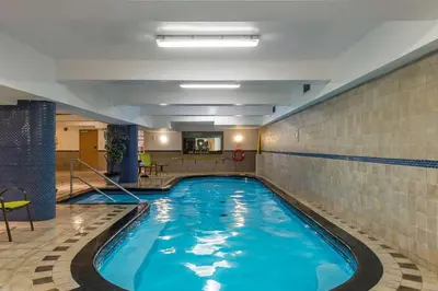 a large swimming pool in a building at Ramada Plaza by Wyndham Montreal in Montréal