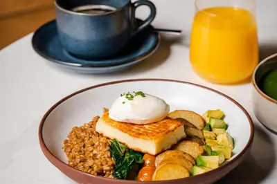 a bowl of food with rice and a cup of coffee at Le Centre Sheraton Montreal Hotel in Montréal