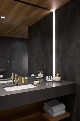 a bathroom with a sink and a mirror at Hôtel de l'ITHQ in Montréal