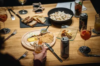 a wooden table with a plate of food on it at Hôtel de l'ITHQ in Montréal