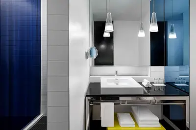 a bathroom with a sink and a mirror at W Montreal in Montréal