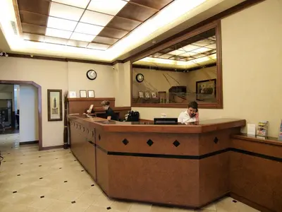 a waiting room with a woman at a hair salon at Hotel St-Denis in Montréal