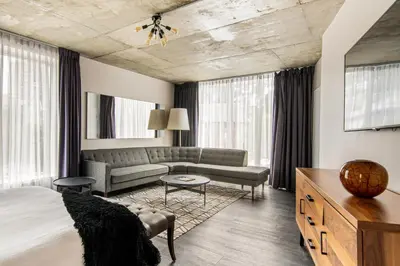 a hotel room with a bed and a couch at HOTEL10 in Montréal
