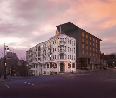a large white building on the corner of a street at HOTEL10 in Montréal
