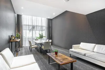 a living room with a couch and a table at HOTEL10 in Montréal