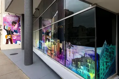 a display window of a building with city images on it at HOTEL10 in Montréal