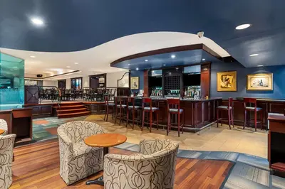 a bar in a hotel with chairs and tables at Best Western Ville-Marie Montreal Hotel & Suites in Montréal