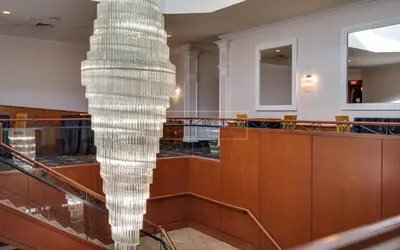 a large glass chandelier in a building at Hotel Universel Montréal in Montréal