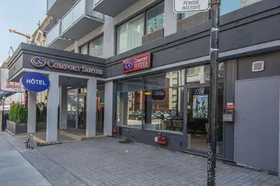 a store front of a building on a city street at Comfort Suites Downtown in Montréal