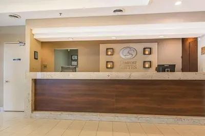 a lobby at a quality hotel with a reception desk at Comfort Suites Downtown in Montréal