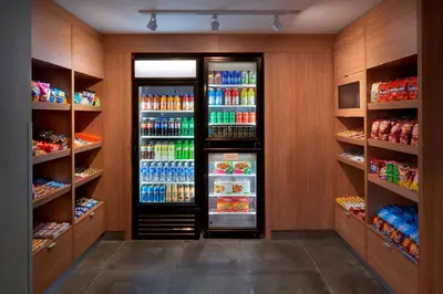 a walk in pantry with a refrigerator with drinks at Fairfield Inn by Marriott Montreal Downtown in Montréal