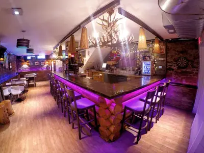 a bar with purple lighting in a restaurant at M Montreal Hostel in Montréal