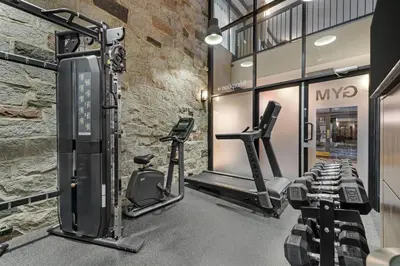 a gym with treadmills and elliptical machines at Best Western Hotel Universel Drummondville in Drummondville
