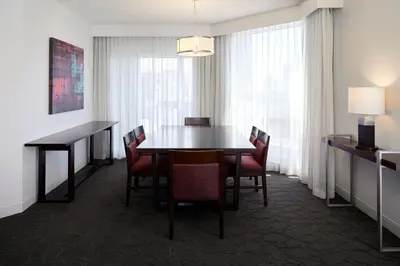 a dining room with a table and chairs at Delta Hotels by Marriott Montreal in Montréal