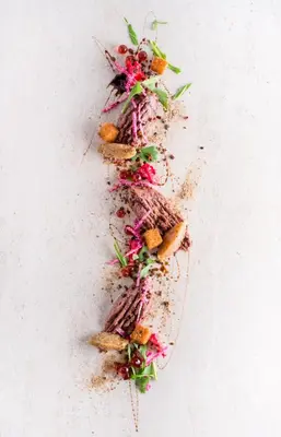 a row of food on a white background at Hôtel Château Joliette in Joliette