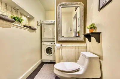 a small bathroom with a toilet and a mirror at Perfect Loft for a Weekend in the Eastern Townships in Ayer's Cliff
