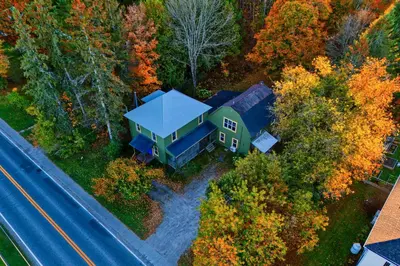 an aerial view of a house in the woods at Perfect Loft for a Weekend in the Eastern Townships in Ayer's Cliff